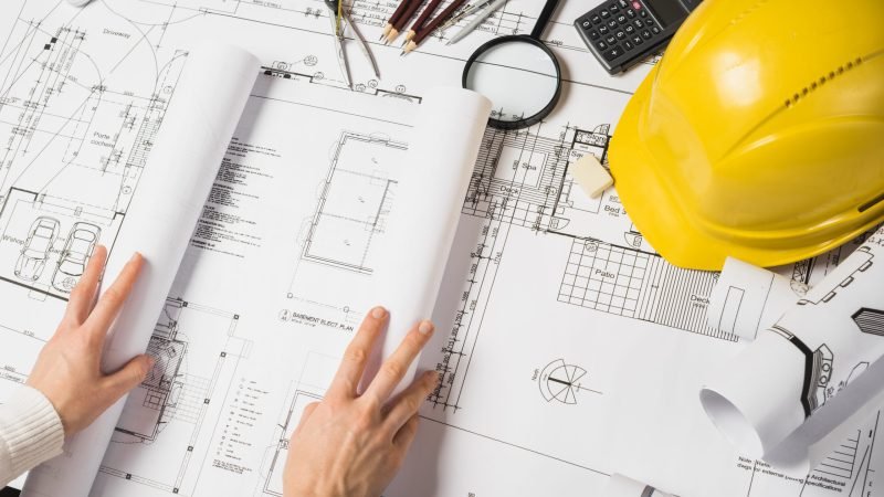 crop-architect-opening-blueprint